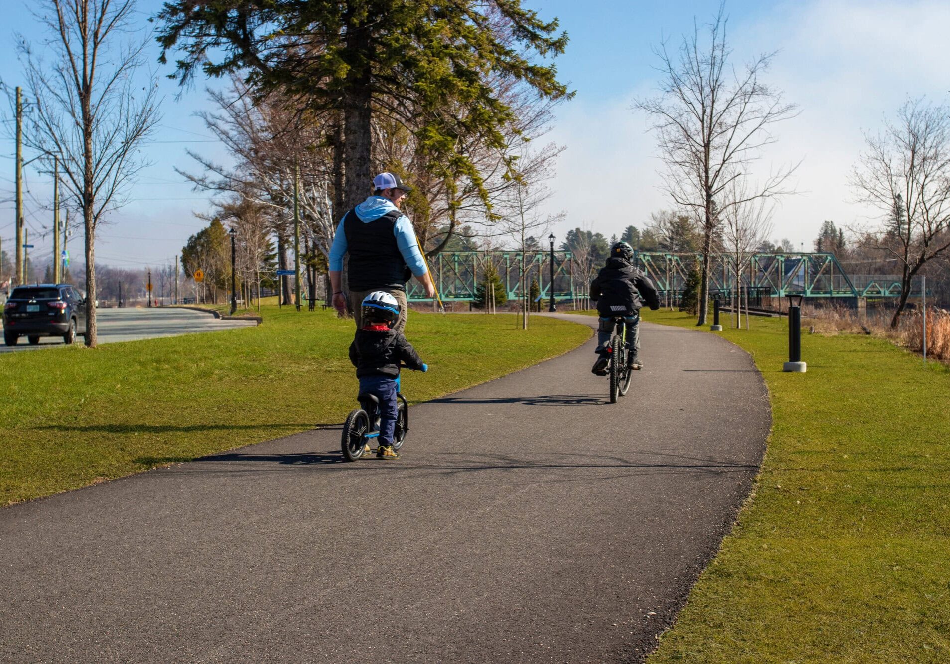 Family biking on multi-use pathway.